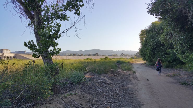 driving bike down sandy trail