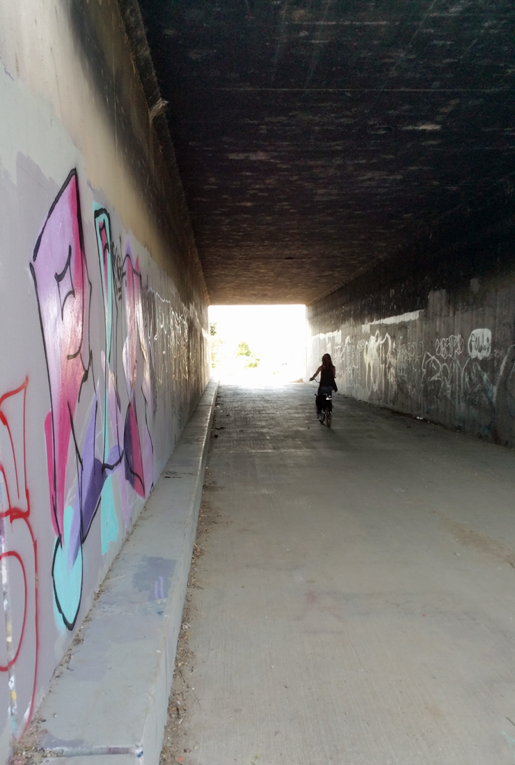 biking through a tunnel