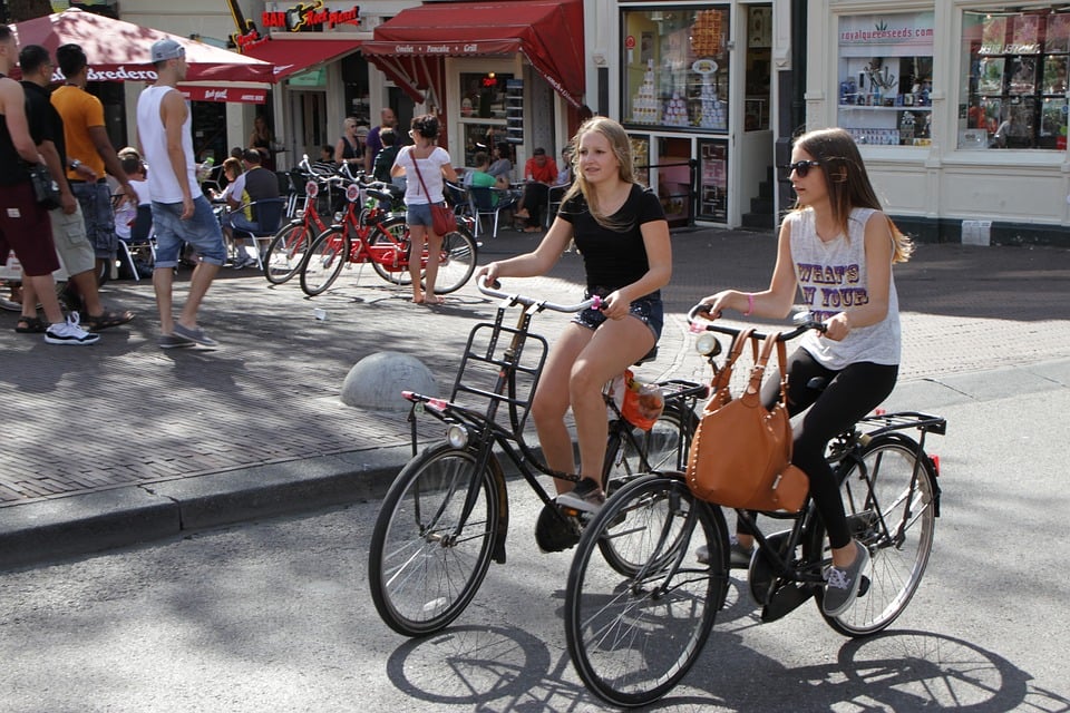 girls riding Amsterdam bikes