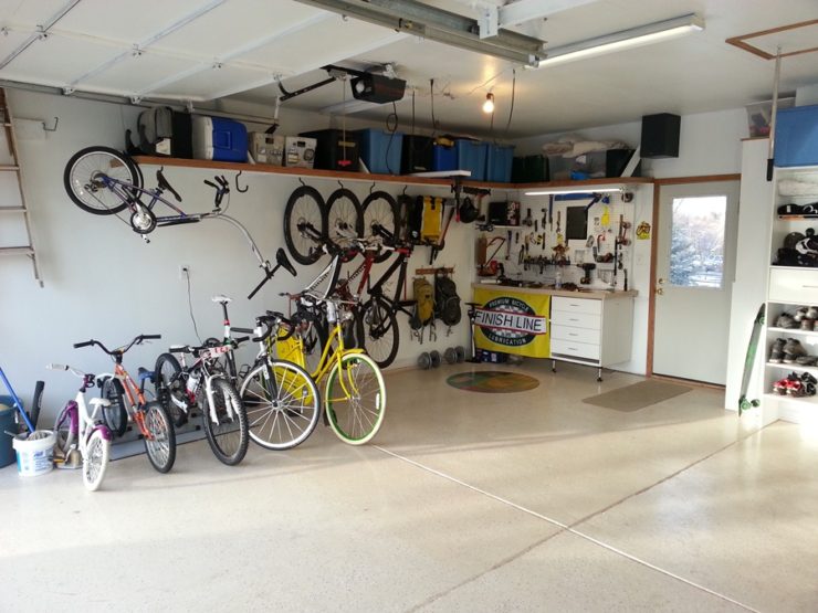 bikes in a garage bikes parked neatly in a garage indicate a benefit of bicycling is added space