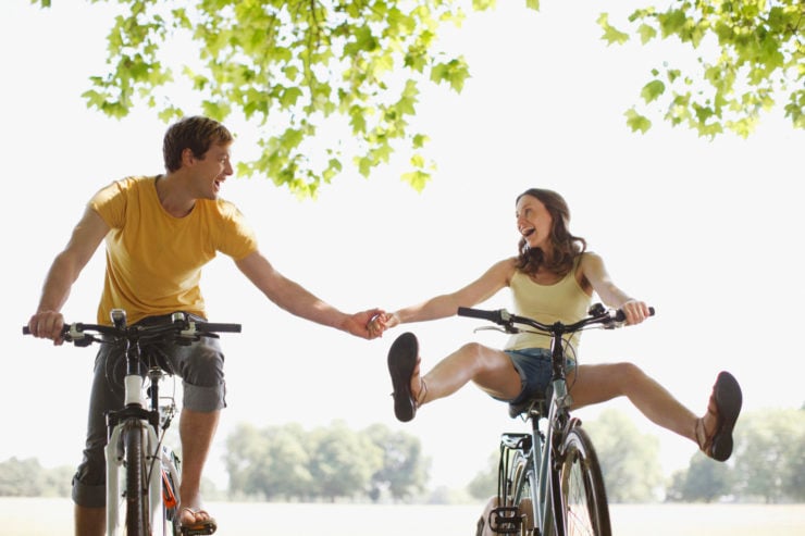 healthy bicycling couple a couple shows the healthy bicycling benefits by being in great shape