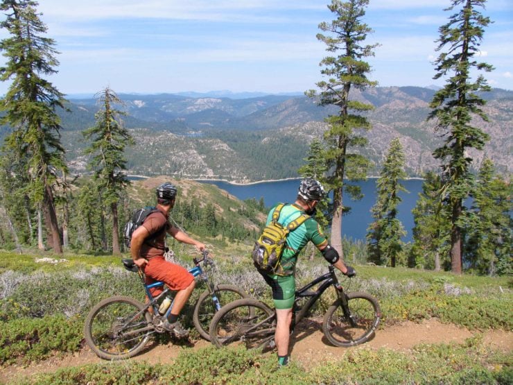 bike riders in mountains two riders in the mountains show a benefit of biking is the scenery