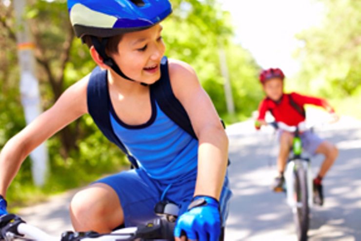 two kids riding bikes two kids enjoy the health benefit of bicycling that is staying young