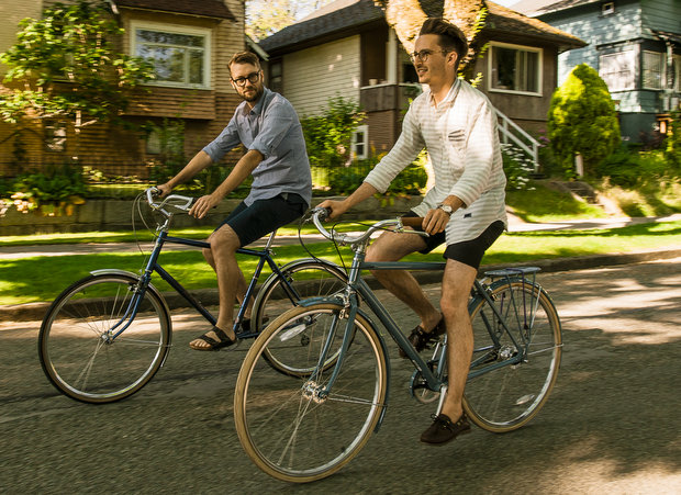 bike riding duo two casual riders enjoy bicycling health benefits on leisurely stroll
