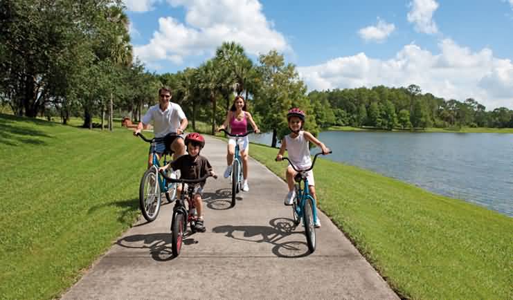 family bike ride a family takes a ride together to reap the benefits of bicycle riding