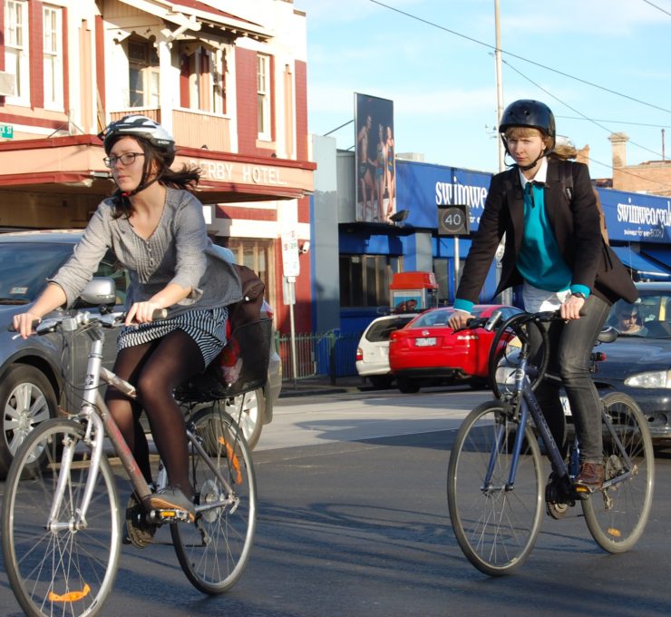 commuting bikers two riders enjoy healthy biking benefits as they commute to work