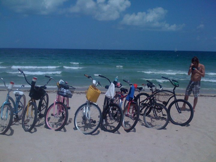 cruiser bikes in the sand by ocean