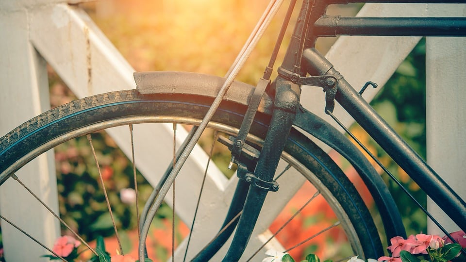 vintage beach cruiser bike by fence